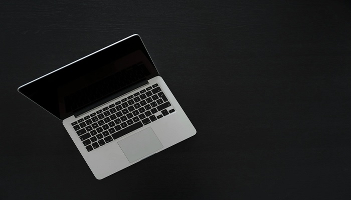 The image shows a MacBook. — Pexels
