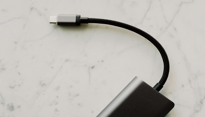 The image shows USB-C cable on white surface. — Pexels