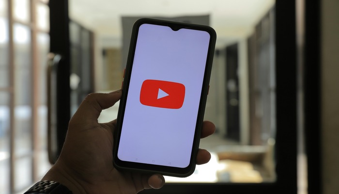 An undated image shows YouTube logo on a smartphone. — Pexels