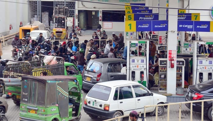 An undated image of cars, bikes lined up at a petrol pump in Karachi. — Online