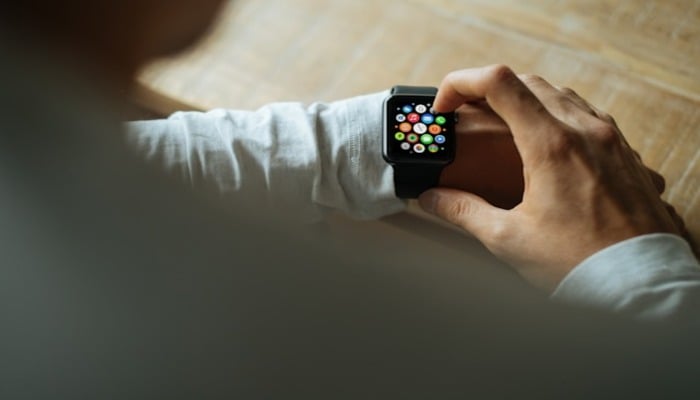 An undated image of a person wearing an Apple Watch. — Unsplash