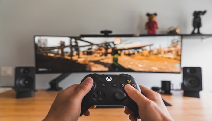 An undated image of a person playing a video game. — Unsplash