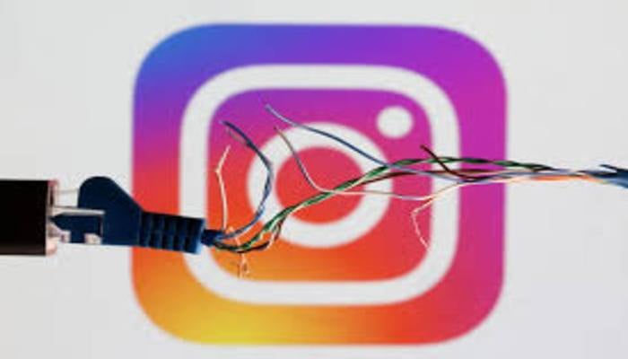 Broken Ethernet cable is seen in front of Instagram logo in this illustration taken March 11, 2022. — Reuters