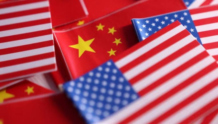 An image of US and Chinese flags illustration created on March 20, 2025. — Reuters