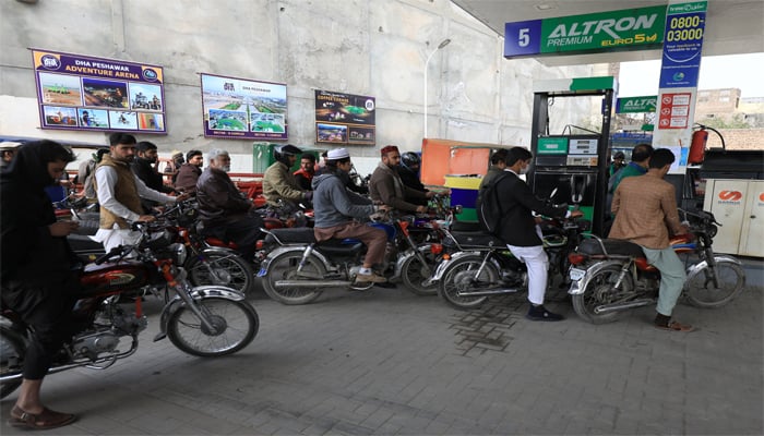 People wait for their turn to get fuel at a petrol station in Peshawar, Pakistan January 30, 2023. — Reuters