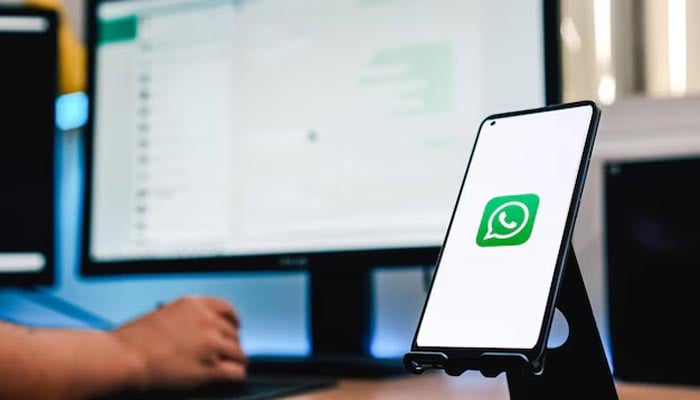 An undated image of WhatsApp logo seen on smartphone and WhatsApp Web on back. — Freepik