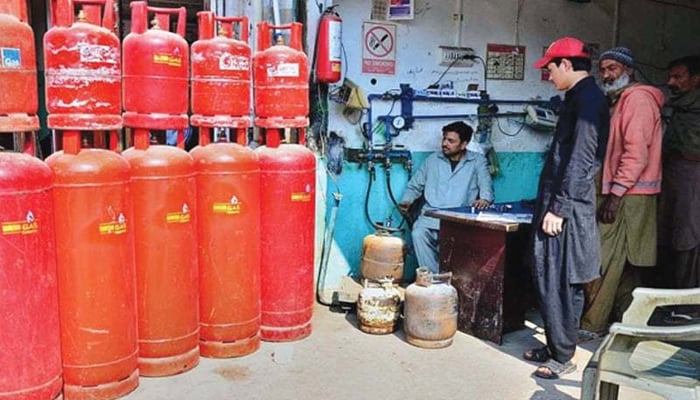 An undated image of a worker who is filling LPG in cylinders.— APP
