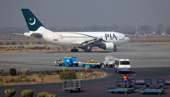 A Pakistan International Airlines (PIA) plane prepares to take-off at Allama Iqbal International Airport in Lahore. — Reuters