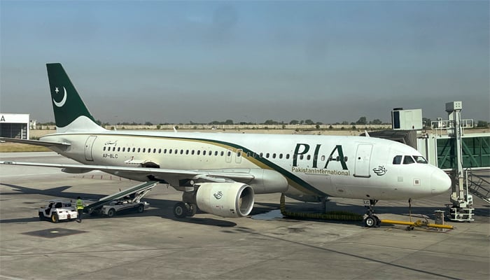 View of a PIA passenger plane, taken through a glass panel, at Islamabad International Airport, Pakistan October 3, 2023. — Reuters