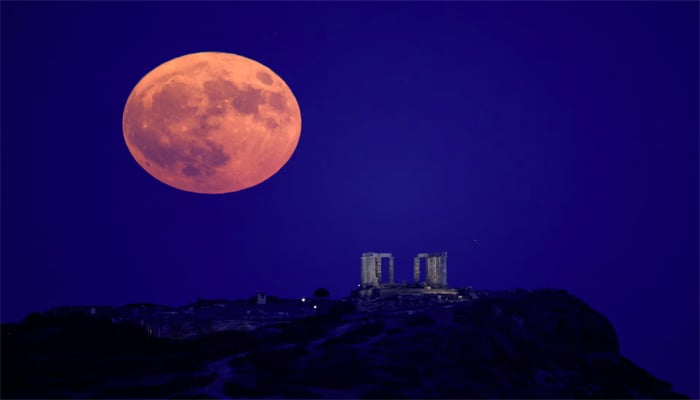 A Supermoon rises over the Temple of Poseidon, on Cape Sounion, near Athens, Greece, August 19. — Reuters