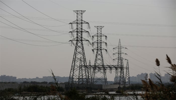 A power transmission tower is seen a day after a country-wide power breakdown, in Karachi, Pakistan, January 24, 2023. — Reuters