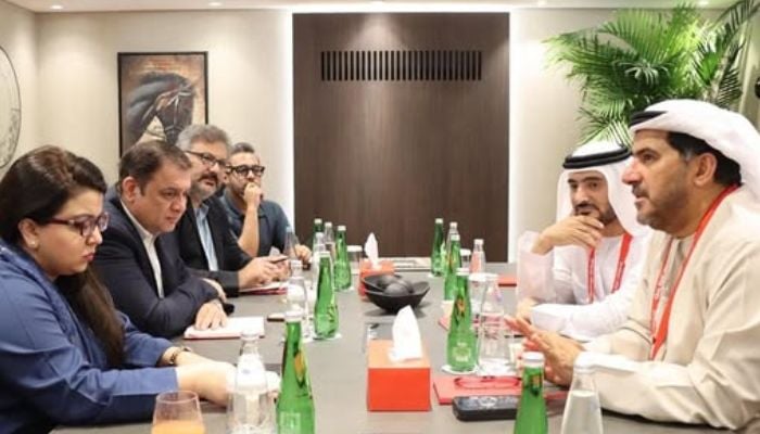 An image of IT Minister Shaza Fatima Khawaja with e& life CEO Khalifa AlShamsi and PTCL President and Group CEO Hatem Bamatraf during a meeting on strengthening Pakistan’s digital infrastructure taken on October 16, 2025. — Facebook/@moitt