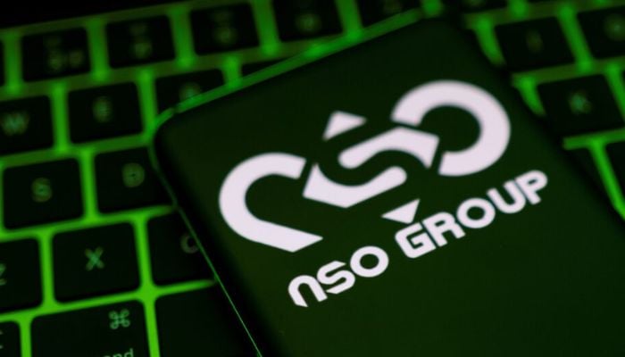 An image of NSO Group logo is shown on a smartphone, which is placed on a keyboard in this illustration taken May 4, 2022. — Reuters