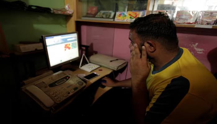 A man explores social media on a computer at an internet club in Islamabad, Pakistan, August 11, 2016. — Reuters