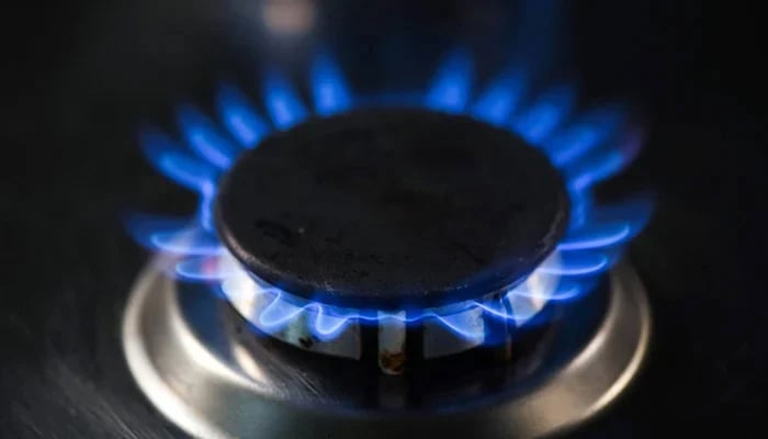 An undated image shows flames of lit burner of gas stove. — AFP