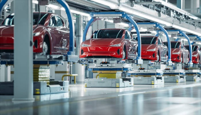 An undated image of electric vehicles assembling. — iStock