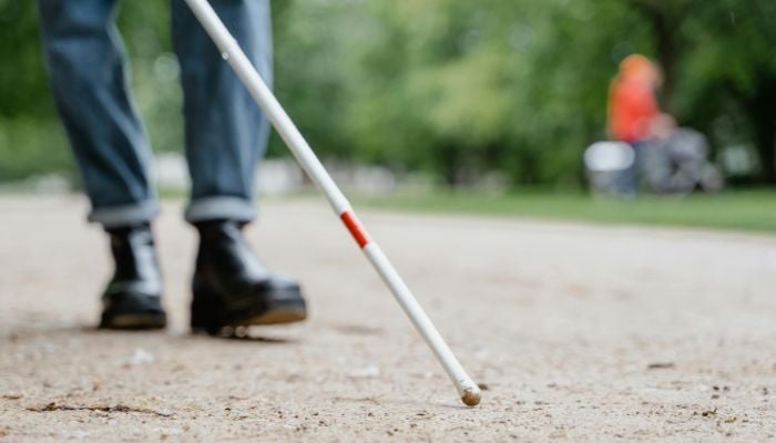 An undated image of a visually impaired man using a walking stick. — Pexels