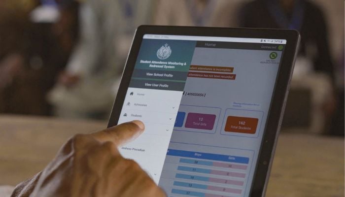 A undated image of a person using SAMRS on a tablet. — X/@MinisterEduGos