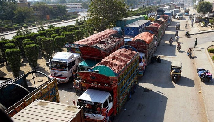 An image shows trucks waiting in Karachi, on November 26, 2017. — AFP