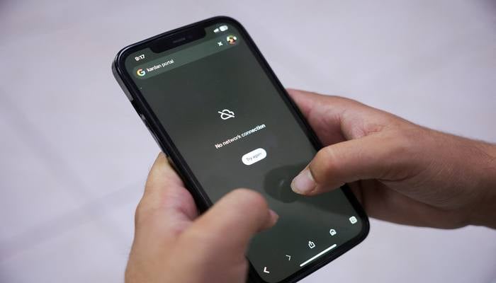 A man tries to use Google on his smartphone amid total telecom shutdown across the country, in Kabul, Afghanistan, September 30, 2025. — Reuters
