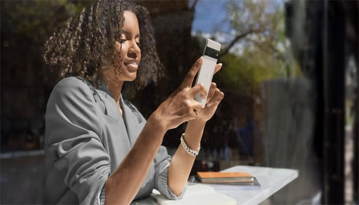 An undated image of girl using Google Pixel smartphone. — Google