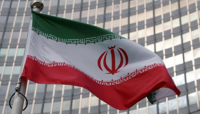 An image of an Iranian flag fluttering in front of the International Atomic Energy Agency (IAEA) organisations headquarters in Vienna, Austria, June 5, 2023. — Reuters