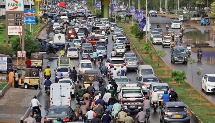 Traffic moves under a bridge in Karachi on July 5, 2022. — Reuters