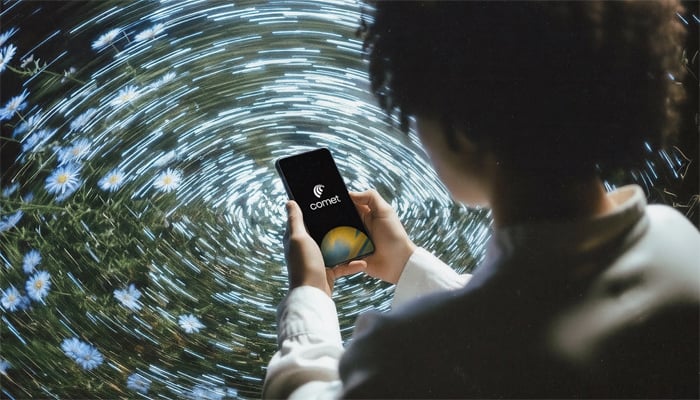 An image shows a person using Comet AI browser on smartphone, taken on November 20, 2025. — Perplexity