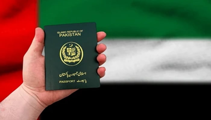 An undated image showing Pakistani passport, along with UAE flag in background. — Shutterstock