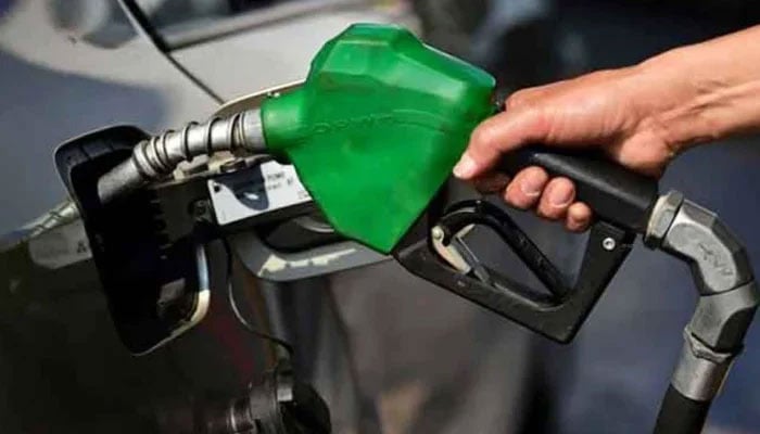 An undated image shows fuel station worker refilling a cars petrol tank. — AFP