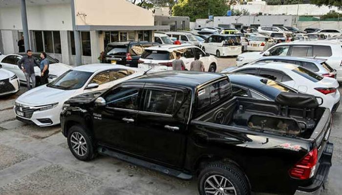 An undated image of vehicles parked at car dealers showroom in Karachi. — AFP/File