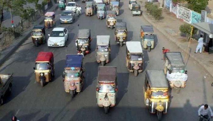 An undated image of four-seater rickshaws is pictured at a busy road in Karachi. — PPI