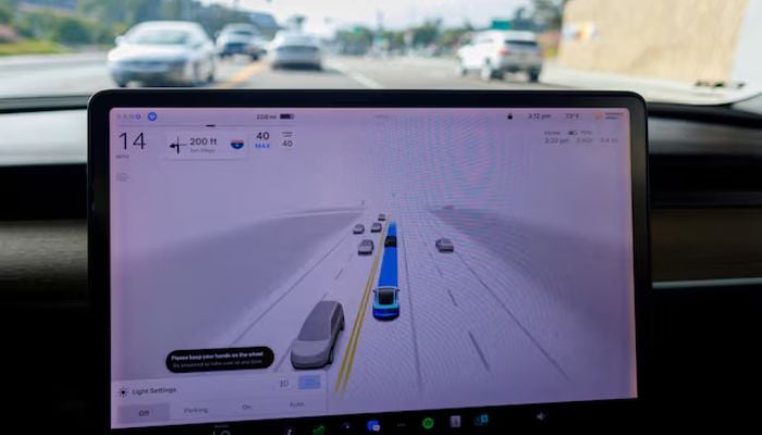 An image of a Tesla Model 3 vehicle warning the driver to keep their hands on the wheel and be prepared to take over at any time while driving using FSD (Full Self-Driving) in Encinitas, California, US, October 18, 2023. — Reuters