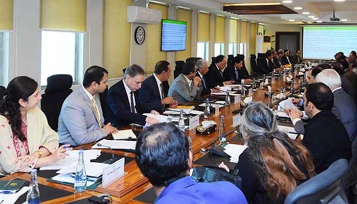 An image of Finance Minister Senator Muhammad Aurangzeb chairing the Economic Coordination Committee (ECC) of the federal meetings meeting at the Finance Division on December 9, 2025. — Facebook/@FinanceMinistryPK