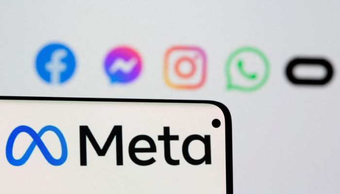 An image of the Meta logo is seen on a smartphone in front of displayed logos of Facebook, Messenger, Instagram, WhatsApp and Oculus in this illustration picture taken October 28, 2021. — Reuters