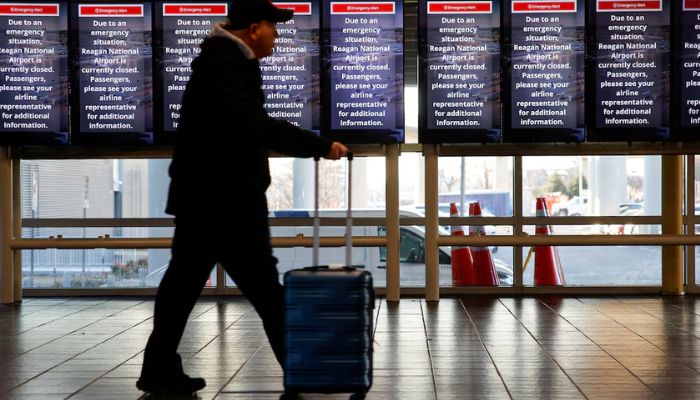 An image of a person walking at Ronald Reagan Washington National Airport in Arlington, Virginia, US, January 30, 2025. — Reuters