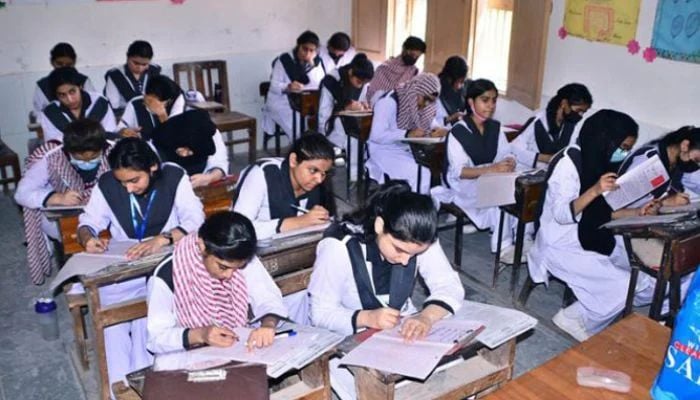 An undated image of female students is pictured during annual board exams at a government college. — APP