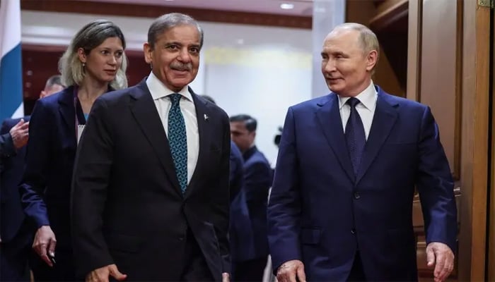 Russian President Vladimir Putin (R) meets with Prime Minister Shehbaz Sharif at the Diaoyutai State Guesthouse in Beijing, China, September 2. — AFP