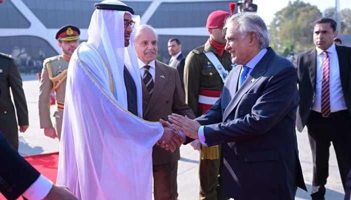 An image of UAE President His Highness Sheikh Mohamed bin Zayed Al Nahyan shaking hands with Pakistan Foreign Minister Ishaq Dar in presence of Prime Minister Shebaz Sharif taken on December 27, 2025. — X/@MIshaqDar50