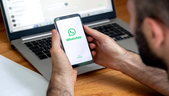 An undated image of WhatsApp app shown on smartphone and laptop. — Depositphotos
