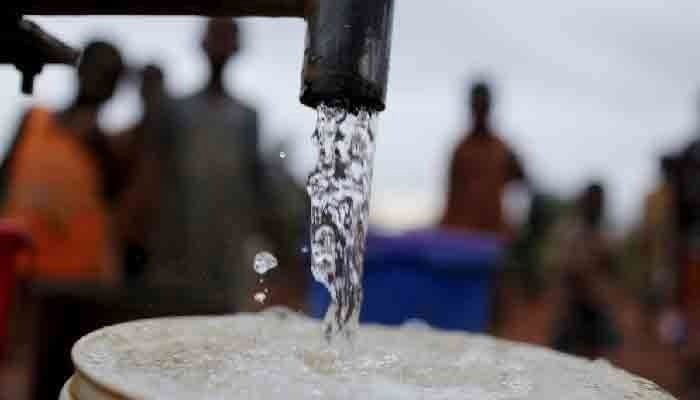 An undated image shows people waiting for their turn to fill their vessels with water. — APP