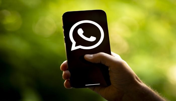 An undated image shows WhatsApp logo on a smartphone. — Getty Images