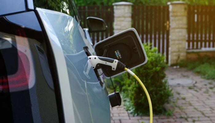 An undated image of a car at a EV station. — DepositPhotos