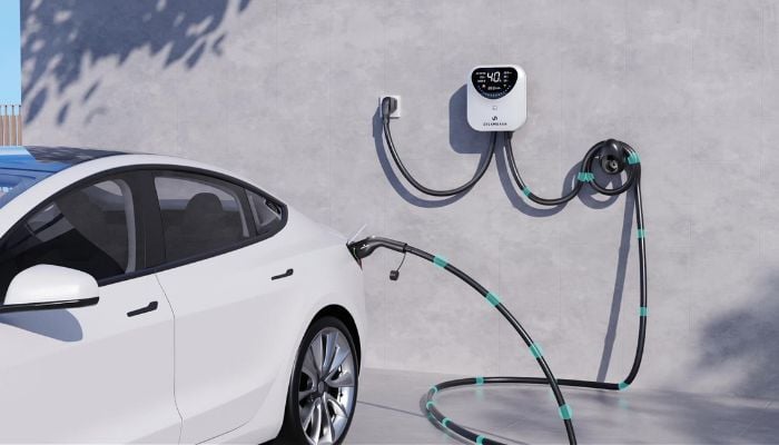 An undated image of a car connected to an EV charger. — DREAMDASH