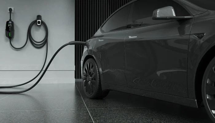 An undated image of a car at a charging station. — EVDANCE