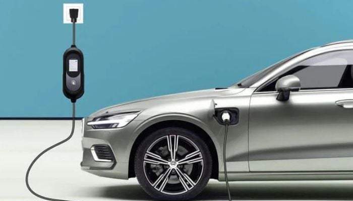An undated image of an EV charger connected to a car. — TopAutoGear